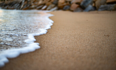 Sea foam and sand on the beach