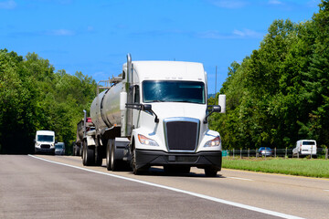 Eighteen-Wheeler Tanker Truck On The Interstate With Copy Space