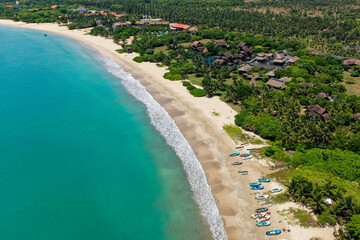 Aerial view of beach, boats and hotels in Pasikuda, Sri Lanka