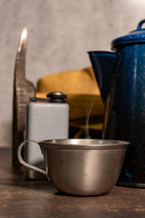 Vintage Tin Cup and Coffee Pot on work bench