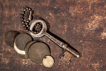 Antique coins worn from use with a skeleton key
