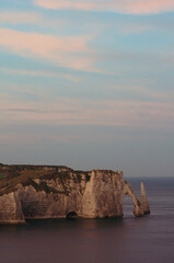 Etretat cliff under asunset sky 