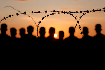 Silhouette of a Crowd of Refugees or Illegal Immigrants | Migration Crisis and Humanitarian Struggle