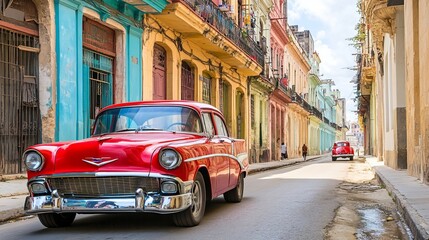 Classic red retro car driving through the historic streets of old Havana, Cuba’s timeless capital