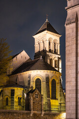 Fototapeta premium The Church of Saint-Pierre de Montmartre is illuminated under the night sky, showcasing its architectural beauty in Paris, France.