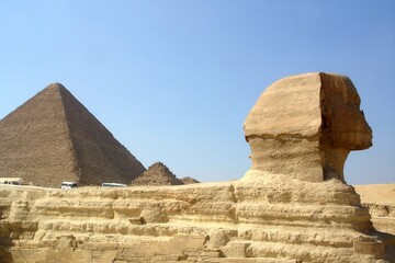 Sphinx Stands Majestically With the Pyramids of Giza in the Background Under a Clear Sky