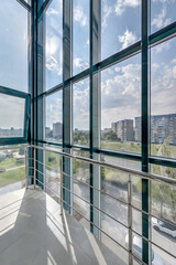 panorama view in empty modern hall with columns, doors and panoramic windows..
