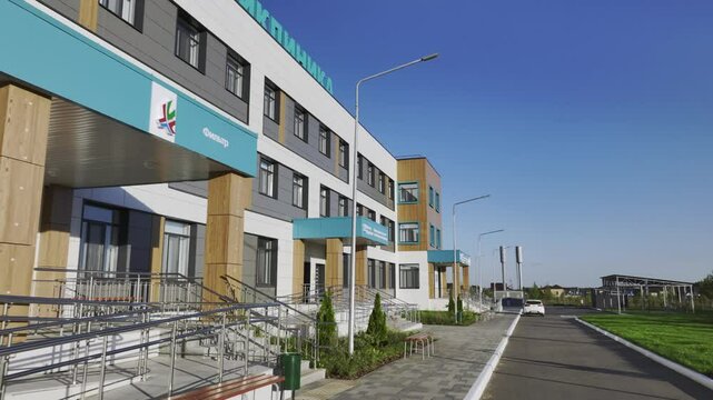 Passageway to children polyclinic with names of departments for convenience of visitors. Contemporary architecture of medical centres