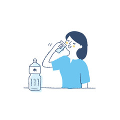 コップの水を飲んでいる女性