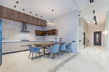 Stylish kitchen design in the interior of a luxurious mansion. Elegant furniture, .beautiful lighting.