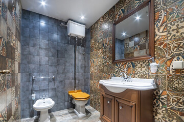 Bathroom interior with exclusive design. The walls are decorated with patterned tiles, .wooden...