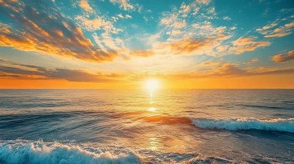Sunset sky with clouds over the sea in the evening. Orange and yellow-gold sunlight during the golden hour with dramatic fluffy clouds. Horizon sea and summer sky landscape at dusk.