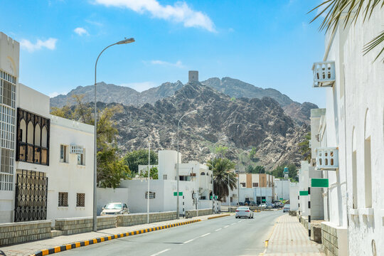 Muscat Takia historical city center streets with road and building with white walls, Oman