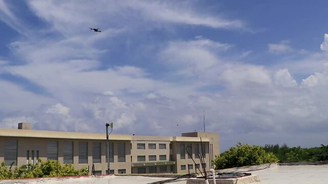 Flying and landing drone with blue sky in Mexico.