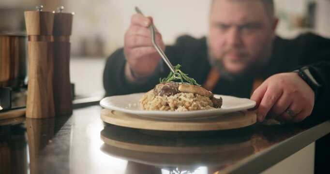 Chef, plate and hands with food at restaurant for hospitality industry, fine dining and nutrition cuisine of cooking. Person, catering service or healthy meal for lunch, vegetable and presentation