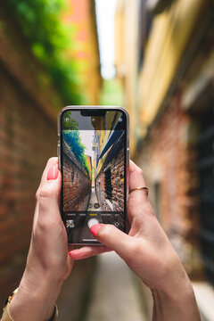 Taking picture of narrow street in Italy, venice