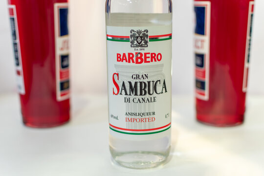 Bottle of Italian liqueur Barbero Gran Sambuca di Canale Anise Liqueur close-up on light background. Ukraine, Zhytomyr, September, 06, 2024