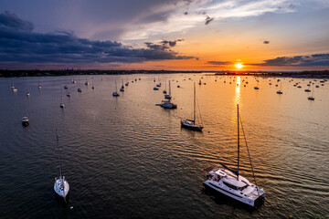 Aerial view of a summer sunset on sailboats in the Long Island Sound