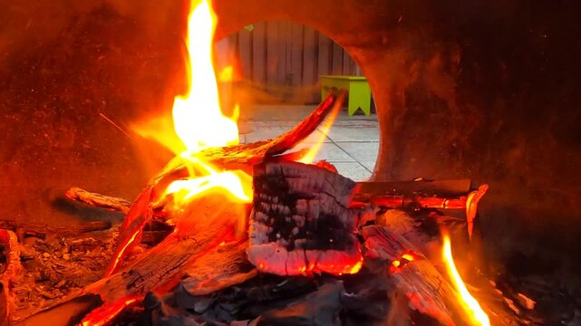 Fire Burning in a Dual-Opening Chiminea