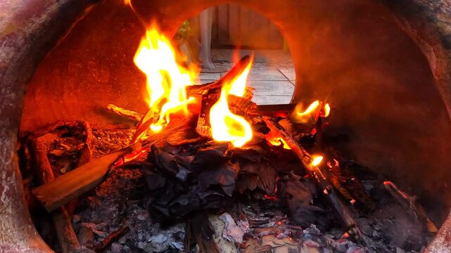 Flickering Flames and Warm Glow Inside the Chiminea