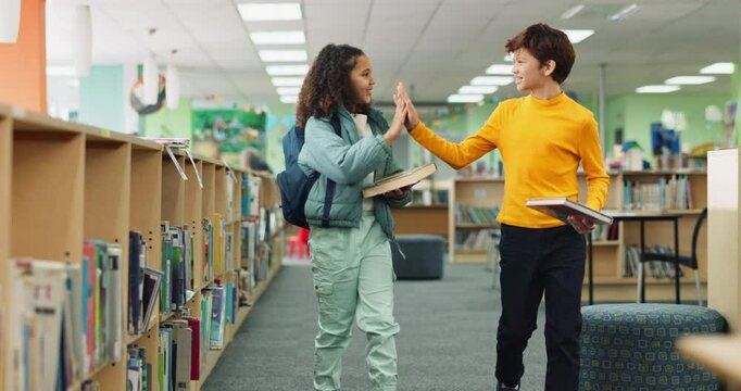 Children, students and high five with books in library, bookshelf and educational development for research. Middle school, literature and information for project success, friends and support together