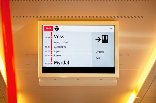 VOSS, NORWAY - JULY 16, 2018: Passenger information system displays a status of the train trip and the list of stations between Voss - Myrdal