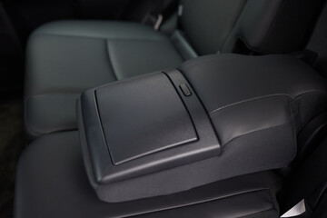 Fototapeta premium Vehicle armrest with cup holder, beige design, for luxury cars