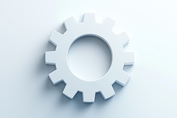A close-up image of a metallic gear set against a sleek, light gradient background.