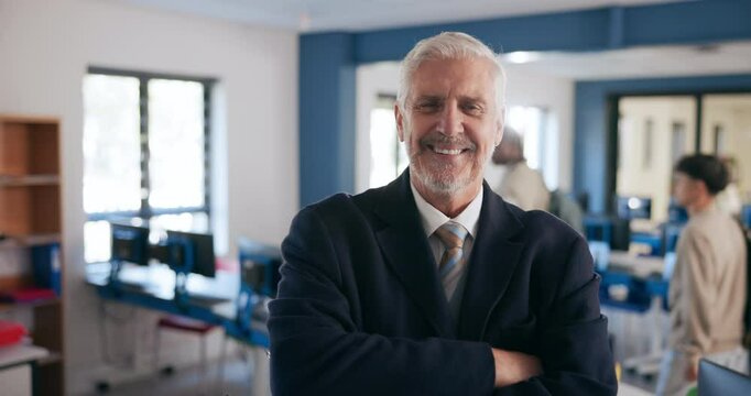Mature man, professor and arms crossed for education in classroom for information technology in high school. Male person, portrait and smile as teacher in confidence on teaching, learning and support
