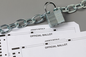 Election ballots with chain and lock. Election security, voting and ballot tampering concept.
