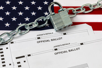 Election ballots with chain and lock on American flag. Election security, voting and ballot tampering concept.