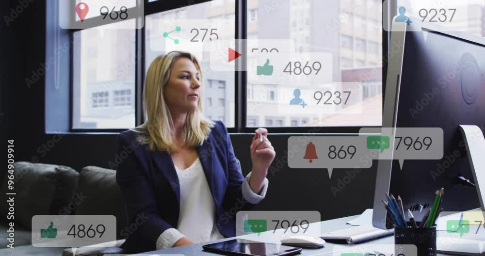 Wall mural animation of icons and numbers over caucasian businesswoman in office