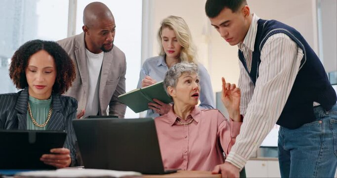 Meeting, laptop and business people with manager in office for project feedback, review or discussion. Computer, help and mature mentor with magazine editing team to publish online journalism article