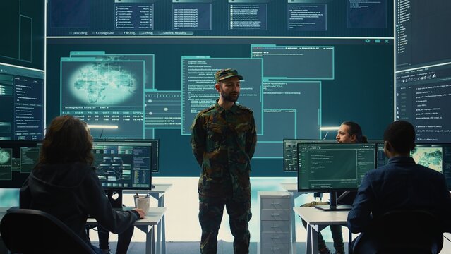 Government military hackers engaged in hybrid warfare strategies. Using sophisticated software and technology to secure information, prevent breaches and protect military operations. Camera B. - Powered by Adobe