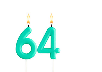 Green birthday candle on white background - Candle number 64
