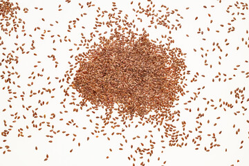 Heap of healthy flax seeds on white background - Linum usitatissimum