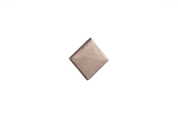 Mini chocolate in bronze foil on a white background.