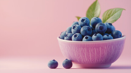 a small bowl of blueberries with a few leaves for garnish against an isolated warm-toned background