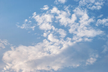 gentle white clouds in the blue sky