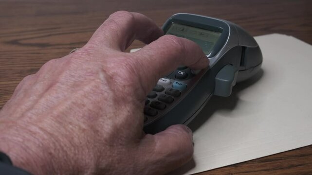 A Label maker is printing a &ldquo;Bills&rdquo; label.