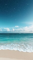 The image depicts a serene beach scene with gentle waves lapping onto a sandy shore beneath a clear blue sky. Fluffy white clouds dot the horizon, and the sky gradually deepens into a night-like effec