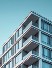 Obraz premium modern architecture building residential urban facade windows balconies glass sunlight contemporary design apartment building exterior view city life real estate 