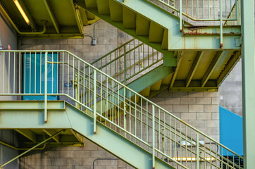 Green Metal Staircase on the Outside Wall.