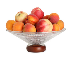 Glass vase with different fresh fruits isolated on white