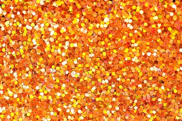 Beautiful shiny golden glitter as background, top view