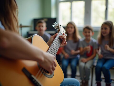 Music Teacher Playing Acoustic Guitar for Attentive Students in Classroom