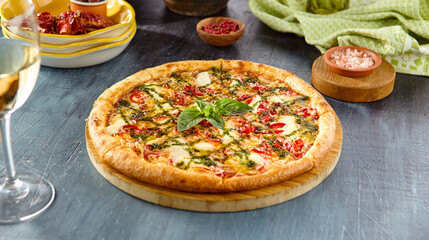 Delicious Margherita Pizza with Pesto Sauce on Rustic Table