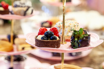 Small mini desserts on a tiered cake stand