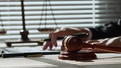 Lawyer concentrating at a desk, crafting closing arguments for court. Focused on a legal case, highlighting the intensity of the courtroom atmosphere