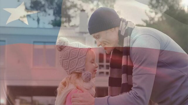 Animation of flag of chile over caucasian father kissing his daughter in forehead
